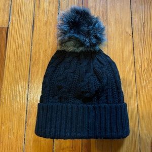 Cable knit beanie with colorful pom pom